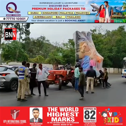 #GaneshIdol Tractor Stuck, Causes Heavy Traffic Jam in #Hyderabad A major traffic jam was reported at the #Lothkunta railway bridge in #Trimulgherry after a tractor carrying a tall #GaneshIdol got stuck under the bridge. The incident led to heavy congestion in the area, forcing commuters to face delays. Traffic police rushed to the spot and diverted vehicles towards #Bhudevinagar to ease the situation. The tractor was later moved, and traffic was restored to normal. | BNN Channel