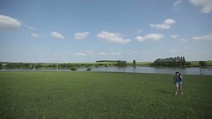 girl running barefoot on the grass