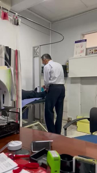 Medical Examination of a Patient's Leg in Clinic