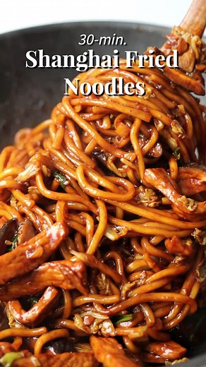 Shanghai Fried Noodles 📝 Recipe link in profile or visit www.christieathome.com & search for recipe with measurements Chewy noodles stir fried in a savory sauce with pork, leafy greens, green onions and shiitake mushrooms. Ready in 30 minutes! These noodles are an iconic dish at Ding Tai Fung, which is one of my favourite dumpling and noodle houses. Packed with flavor, these Shanghai noodles are so addictive to eat. Now you can easily make them at home. #Asianfood #foodtiktok #recipes #noodle #