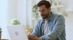 Young Man Freelancer Student Using Laptop Stock Footage Video (100% Royalty-free) 1032517127 | Shutterstock