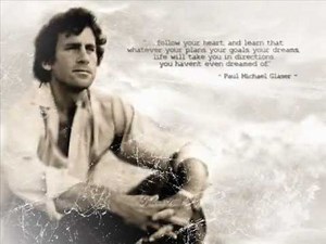 P.M. Glaser playing guitar and singing