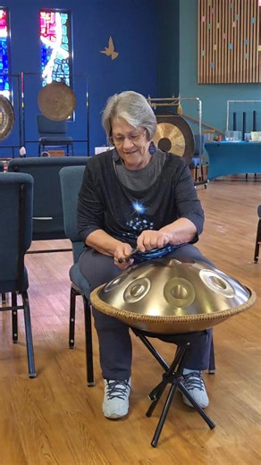 Judy Olson demonstrates using mallets on the new handpan she donated to Unity Center of Des Moines for meditation and sound healing. Thanks Judy! | Unity Center of Des Moines