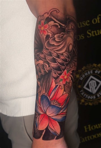 Stunning Half Sleeve Koi Fish Tattoo at House of Tattoos
