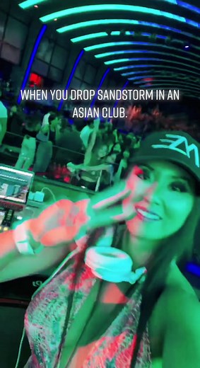 Asian Female DJ Drops Sandstorm in the Club
