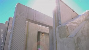 Precast concrete wall panels in factory to transport and install