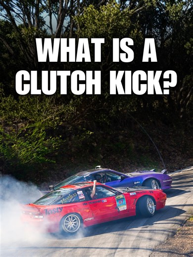 A clutch kick is another way to start a drift, instead of using the handbrake or power over. It works best when you already have some momentum. If you’re going too slow, it’ll still work, but you risk stressing and breaking your drivetrain. Here’s how to do it: As you approach the corner, position the car on the outside and turn in. Press the clutch in, then rev up about 3,000 RPM. Pop the clutch out quickly. That sudden shock sends power to the rear wheels, breaking traction and letting the bac
