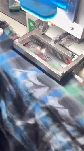 sewing dark blue patterned fabric precisely using a professional automatic sewing machine