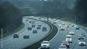 Multi-Lane Highway With Many Cars On Cloudy Day