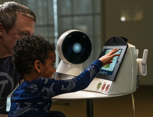 Social robots as conversational catalysts: Enhancing long-term human-human interaction at home