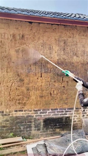 Renovation of a century-old house, with mud brick wall protection underway.