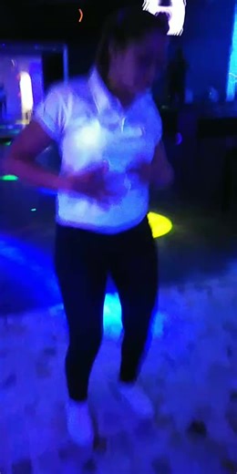 Dynamic Dance Moves in a Vibrant Club Setting