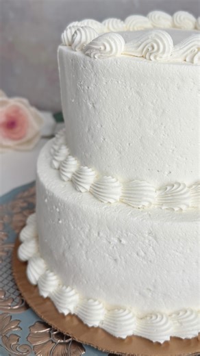 Wood Flower Artist | Sola Flower Sam on Instagram: "$50 wedding cake reveal ✨ I ordered a simple, classic two-tier wedding cake from H-E-B, and it turned out exactly right. If you are a Texas bride looking for an affordable option, this is a reliable choice. Clean design, neutral base, and easy to customize to match your style. There was a brief hiccup with pickup. The order was set for Friday instead of Thursday, which put us a day behind for photos. After sorting it out, we picked up the cake.