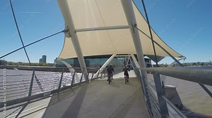 Couple Riding Bikes At Tempe Town Lake Bridge- Tempe Arizona