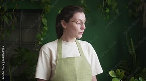 Professional female gardener talks about caring for plants. Online video broadcast of training. Study a course about home flowers remotely