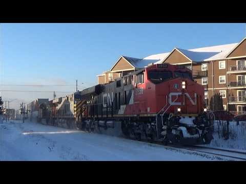 Long Stack Train CN 120 w/SD75IACC DPU Rolling thru Downtown Moncton, NB - Air Car on Rear