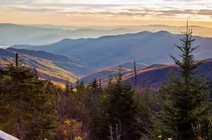 Great Smoky Mountains National Park Established in 1934, Great Smoky Mountains National Park is America's most visited national park! Ridge upon ridge of forest straddles the border between North Carolina and Tennessee where visitors experience the rugged grandeur and inspiring views. The park is world renowned for its diversity of plant and animal life, the beauty of its ancient mountains, and the remnants of Southern Appalachian mountain culture. LEARN MORE > https://national-park-posters.com/
