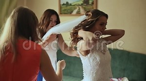 Beautiful Bridesmaids Helping the Happy Bride Getting Dressed. Stock Footage - Video of event, adorable: 90004284