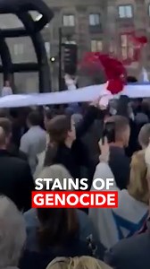 During a pro-Israel demonstration in Amsterdam, the capital of the Netherlands, Marlisa Hommel, an English teacher from Utrecht University, splashed red paint on the Israeli flag to highlight the bloodshed in Gaza. | A News