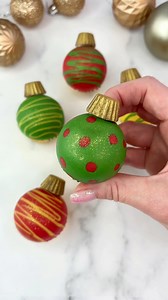 1.7M views · 6.3K reactions | Turn mini cupcakes into Baubles ❤️ I used a silicone ice cube tray to make these. The coloured patterns are candy melts. I added vanilla buttercream and a baked cupcake on top before chilling them in the freezer. ❤️ #cupcakes #mini #christmasbaking #baublecupcake #christmasinspo #cakedbyrach #cakeart #cupcakedecorating #cupcakesforanyoccasion | Caked By Rach | Facebook