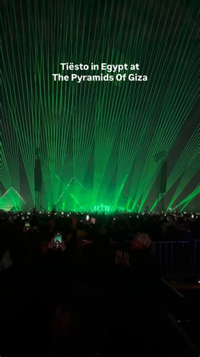 Cairo Spots on Instagram: "Tiësto is live at the Pyramids of Giza. Hit after hit, classic after classic, with the crowd reacting to every drop. The pyramids stay lit behind the stage as the set leans deep into the tracks everyone knows, turning the Giza Plateau into a shared memory in real time. One of those nights where the music does all the talking, happening right now under the pyramids. Follow @cairospots, visit our website cairospots.com and download our Cairo Spots iOS app for live update