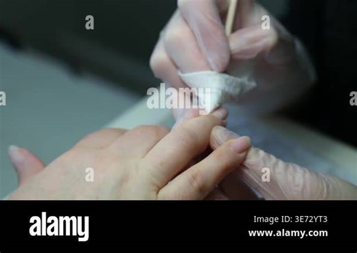 nail master applying gel polish, step by step guide.manicurist is using a nail file,drill, first,remove cuticle with nipper and push with stick.woman buffing,clean,degrease and using uv lamp. 4k Stock Video Footage - Alamy