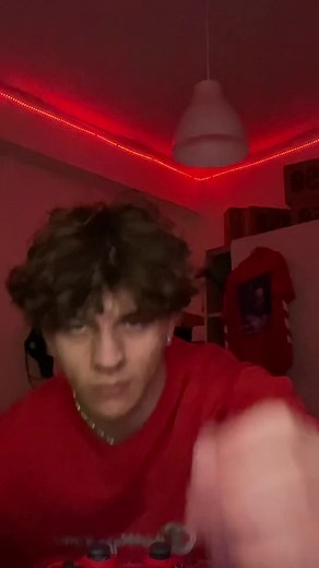 Red Light Gaming Setup with Champion Sweatshirt