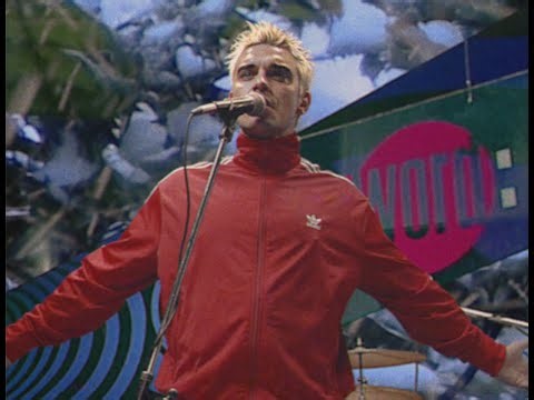 Watch Robbie Williams travel back in time to perform on ‘The Word’ for new ‘Pretty Face’ video