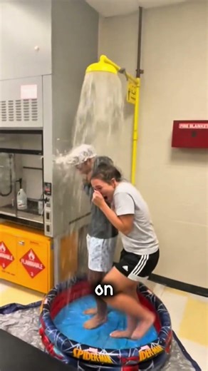 Student Taking Shower In Chemistry Class.