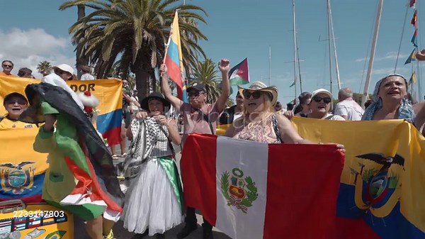 Latin american protesters chant pro-Palestine slogans as they hold...