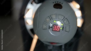 Close-up lighting equipment with electronic power scale for Studio video or photo shooting. Spotlight with halogen bulb and Fresnel lens. Lighting equipment for Studio photography or videography. Stock Video