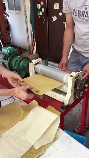 Making beeswax foundation.