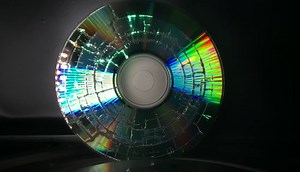 Watch a Microwave Nuke a Windows 7 DVD in Glorious Slow Motion