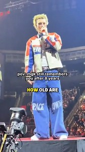 mgk fan in 2017 vs now. This soundcheck kid/guy @dawson.19xx is iconic. 📝: mgk is on the lost americana tour. mgk had a concert at Rogers Place in Edmonton, Alberta, Canada on December 1, 2025. There was a fan there who had attended the Edmonton show during the 2017 Alpha Omega Tour. The fan was holding a sign that said, "Edmonton Alpha Omega Tour 2017 Soundcheck kid," and mgk recognized the fan. mgk asked, "How old are you now, dawg?" The fan said, "20." mgk asked, "I was gonna say you're a gr