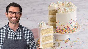 This moist fluffy white cake recipe covered in creamy Swiss meringue buttercream might just be the perfect cake! ✅ RECIPE: https://preppykitchen.com/white-cake-recipe/ | Preppy Kitchen