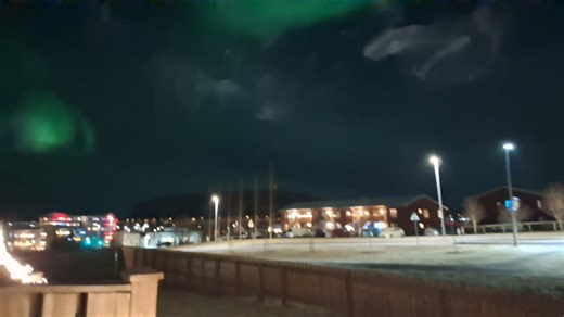 Aurora borealis lights the night sky in Reykjavik, Iceland