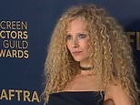 Juno Temple rocks frizzy hair and a black dress at the 2024 SAG Awards