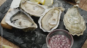Fresh raw edible oysters, popular shellfish seafood close-up. Mollusk marine oysters.