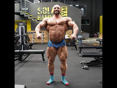 Bald bearded huge muscle god Igor Illes (#Slovakia)´s posing in sweaty boxer briefs