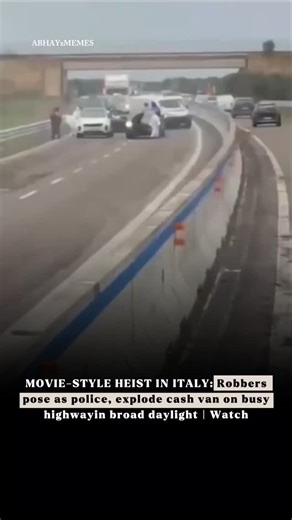 AbhayxMemes on Instagram: "Robbers pretending to be police pulled off a movie-style stunt on a busy Italian highway, blowing up an armoured cash van in broad daylight – and the whole thing was caught on camera. The dramatic scene unfolded on State Road 613 in southern Italy’s Puglia region on Monday morning. Masked men armed with Kalashnikov rifles shut down the highway after setting a truck on fire and rolling in with flashing lights, making it look like an official police operation. Drivers ha