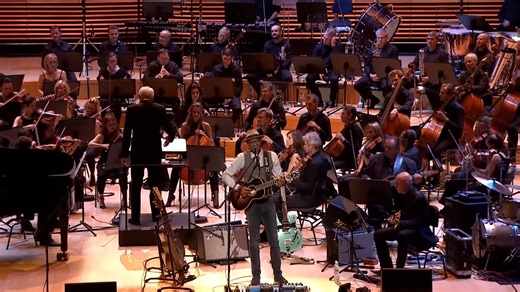 2016 - Keb’ Mo’ took the stage at the RAWA Blues Festival in Poland with NOSPR to perform “Henry" – an especially moving tribute to the legendary, Taj Mahal – an early inspiration turned long-time friend and musical partner in TajMo. 📺 Watch the entire concert at the link in the comments. Who's been spinning their latest creation, Room On The Porch? 🎧 What track are you playing on repeat? 🔁 👇 #KebMo #TajMahal #Henry #RoomOnThePorch | Keb' Mo'