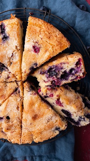 Julie Clark | Tastes of Lizzy T on Instagram: "Red White and Blueberry Cake! This fresh berry cake makes the perfect breakfast or dessert for the 4th of July. My favorite part? The sugar sprinkle baked on top! 🫐 Comment BERRY to get the recipe in your inbox. https://www.tastesoflizzyt.com/red-white-blue-berry-cake/"