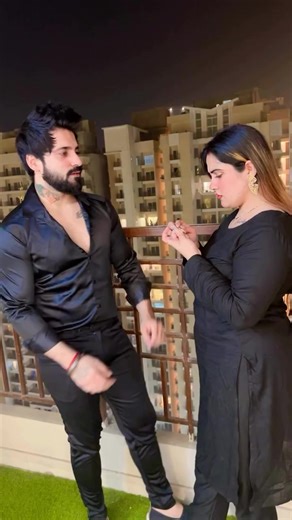 Intimate Nighttime Moments on a City Balcony