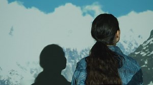 Woman Visiting Immersive Art Exhibition With Images Of Clouds And Mountains Being Projected Onto Her Body | Free Stock Video Footage