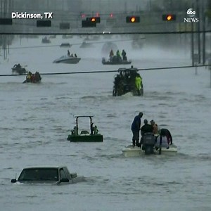 Astounding video shows numerous boats maneuvering around stranded vehicles on flooded street in Dickinson, Texas. http://abcn.ws/2viNtQN | ABC News