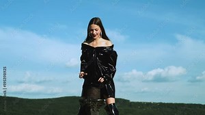 Magician girl making magic. Rabbit in a hat. Illusionist pull a rabbit out of hat.