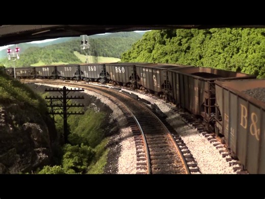 Here's some old footage from 2016 when the signals were facing the wrong direction and the ballast was light grey!! These passing trains are on the same track but about 75ft apart on different sides of the basement...... | Industrialmodels