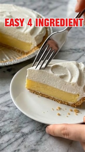 🍋 Zesty Lemon Cream Pie | A Slice of Pure Sunshine Nothing feels quite like home like a chilled, creamy dessert waiting in the fridge. This Zesty Lemon Cream Pie is the ultimate nostalgic treat—light, airy, and bursting with that bright citrus flavor we all crave. Yield: 8 generous slices Ingredients: 1 pre-made graham cracker pie crust (9-inch) 1 cup premium lemon pudding, prepared and chilled 1/2 cup sweetened condensed milk 1 tub (8 oz) whipped topping (like Cool Whip), thawed 1 teaspoon fre