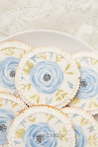 53K views · 1K reactions | Have you ever painted on cookies? It's important to start with a good royal icing base so that you don't have any pitting as you apply the edible paint. See all of my tips for painting on royal icing in this post on my blog: https://www.sweetambs.com/tutorial/painting-on-royal-icing-with-food-coloring/ The full video tutorial for these watercolor flower cookies is available on Patreon: https://www.patreon.com/posts/49360785 | SweetAmbs | Facebook