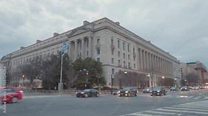The Robert F. Kennedy United States Department of Justice Building in downtown Washington, D.C. seen at dusk in the winter from the intersection of Constitution Avenue NW and 9thth Street NW.